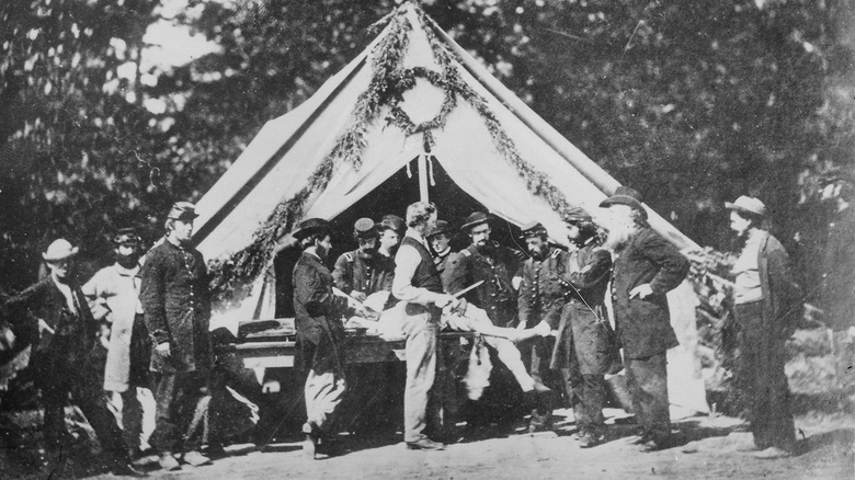 1800s men surround patient