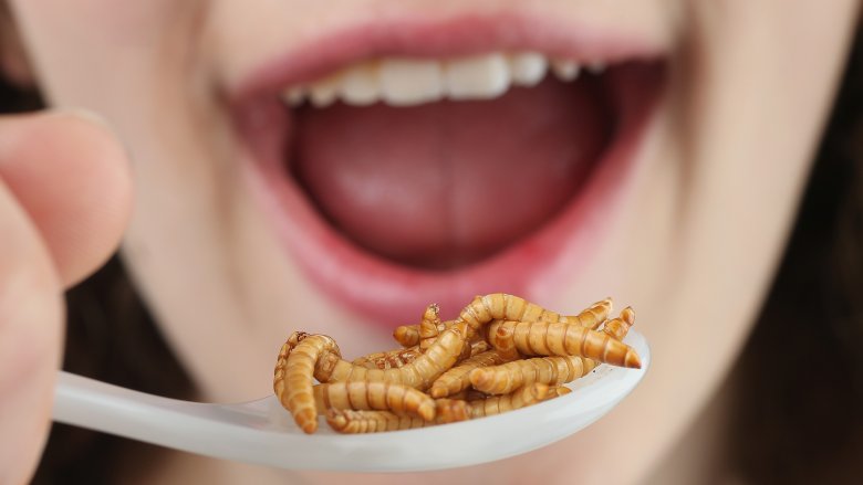 Woman eating insects