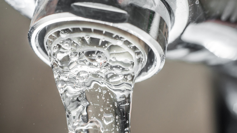 Water flowing out of water faucet
