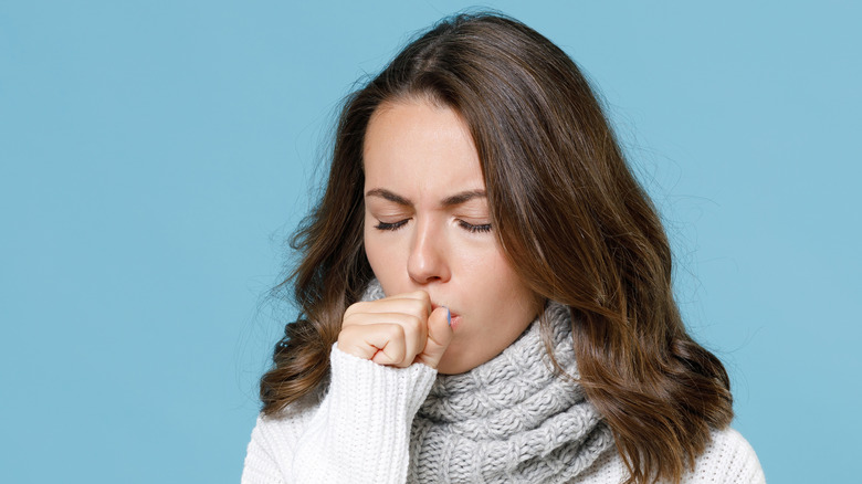 woman covering her mouth