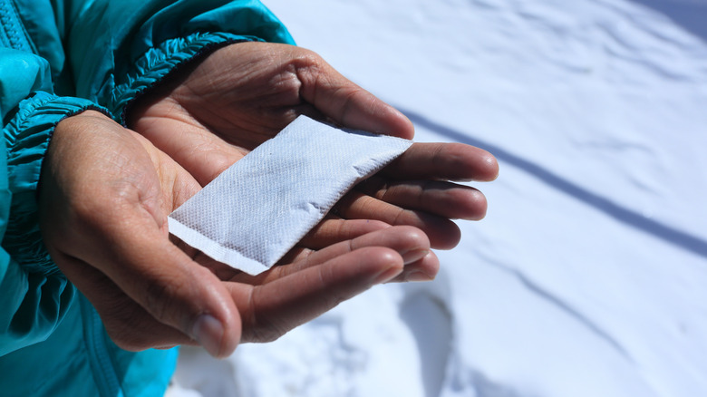 holding a chemical hand warmer