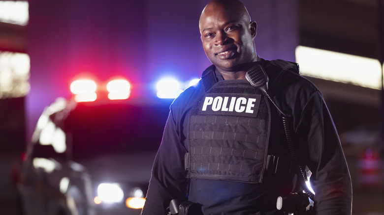 police badge, gun and handcuffs on american flag