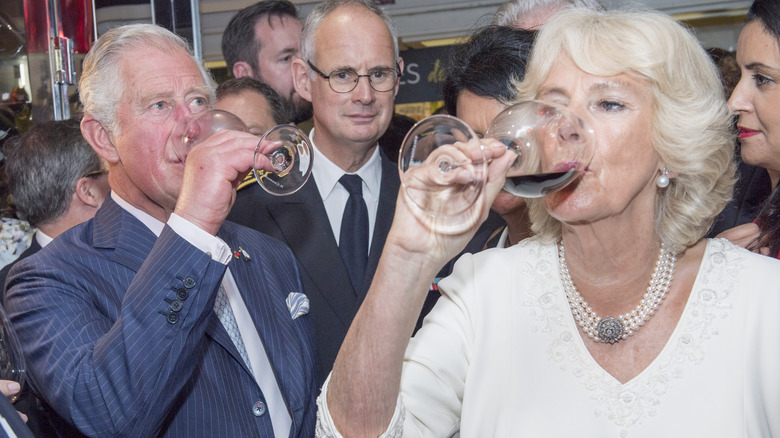 Charles and Camilla drink wine