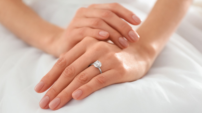a diamond on a woman's hand