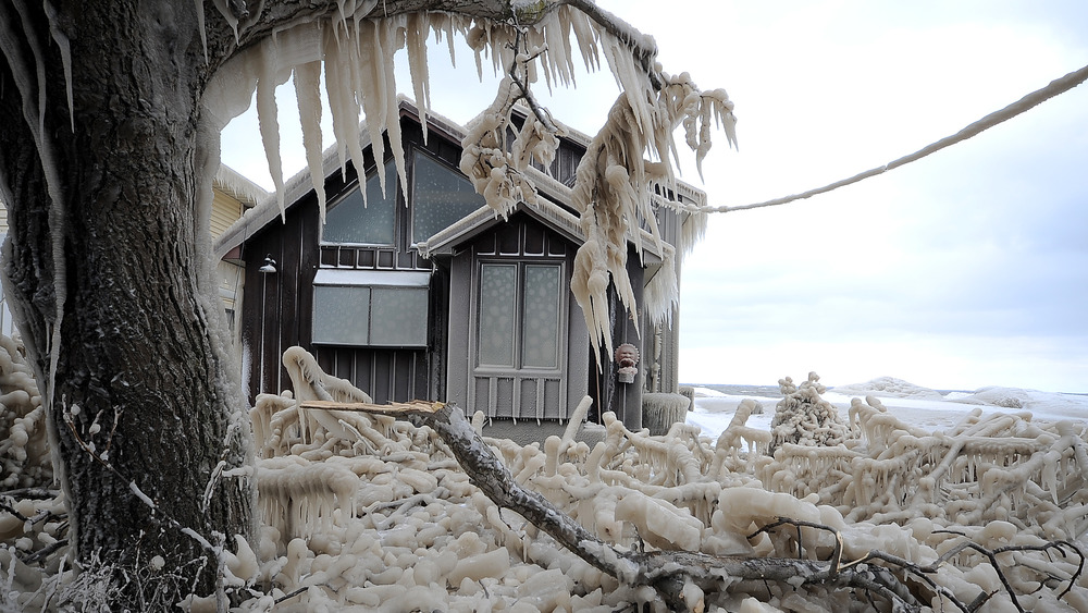 House covered in icicles in cold weather