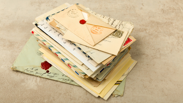 pile of vintage letters in envelopes