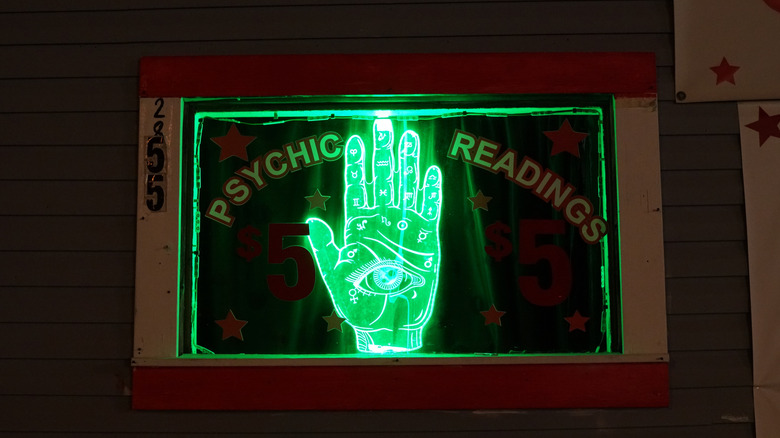 neon palm signage for a psychic