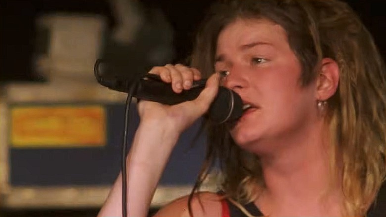 Mia Zapata performs on stage