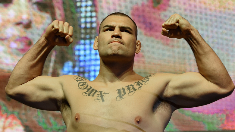 Cain Velasquez clenching and holding up fists