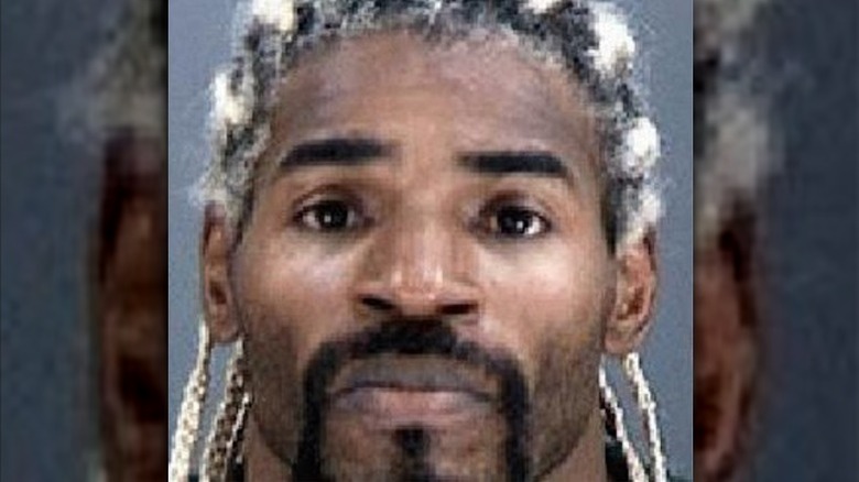 hardbody harrison looking down in wrestling ring