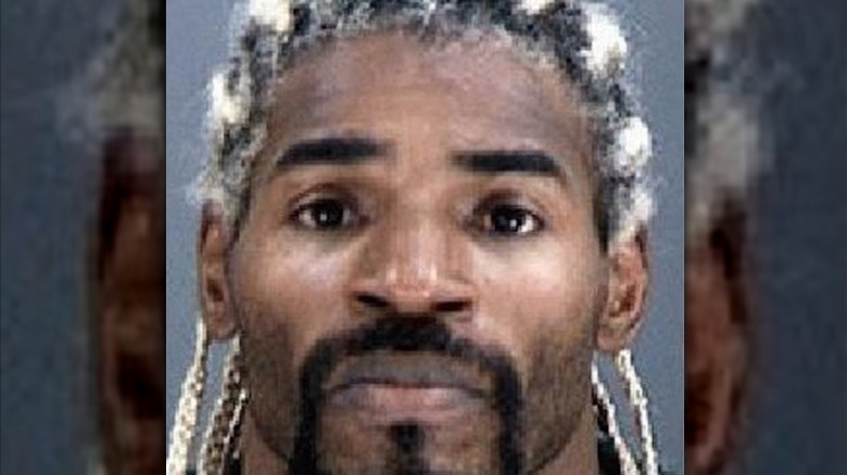 hardbody harrison looking down in wrestling ring
