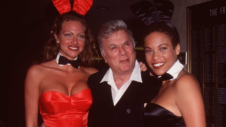Tony Curtis posing with Playmates