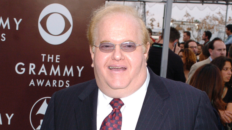 Lou Pearlman in suit and glasses smiling at Grammys