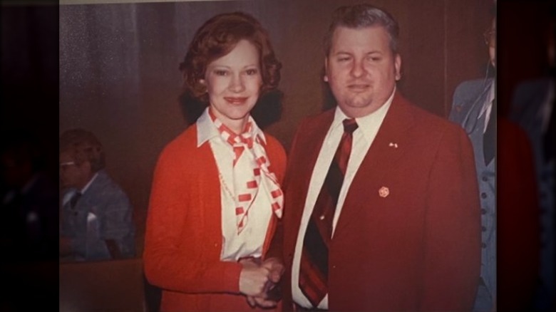 Rosalynn Carter and John Wayne Gacy smiling at event