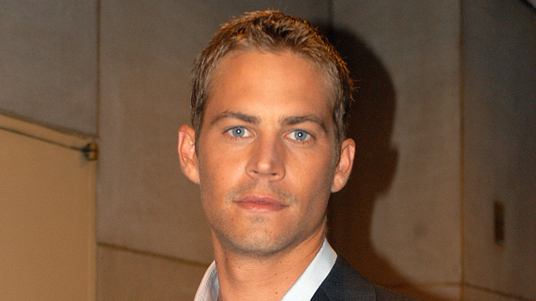 Paul Walker staring in suit at event