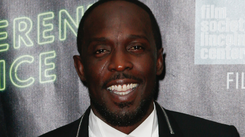 Michael K. Williams in tuxedo smiling at event