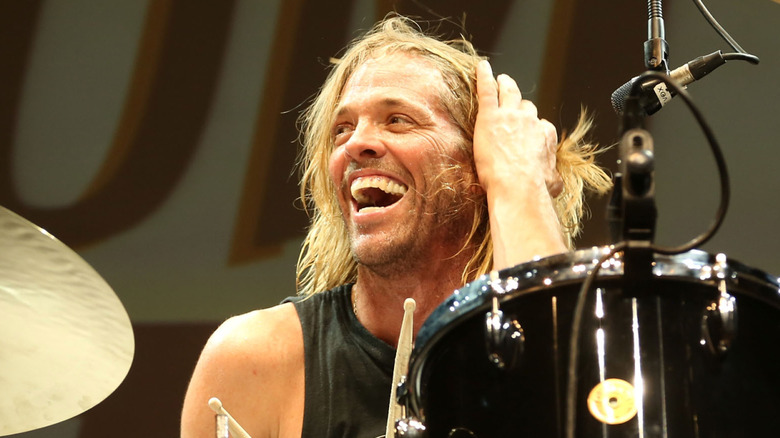 Taylor Hawkins smiling while playing drums