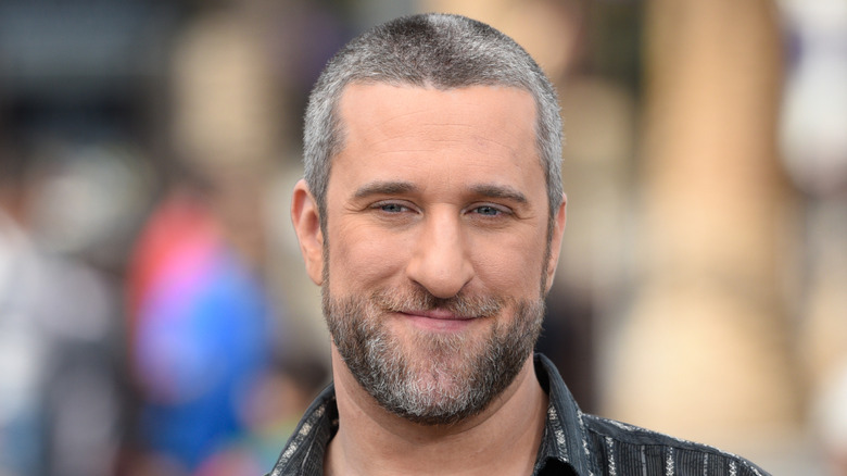 Dustin Diamond with gray hair smirking
