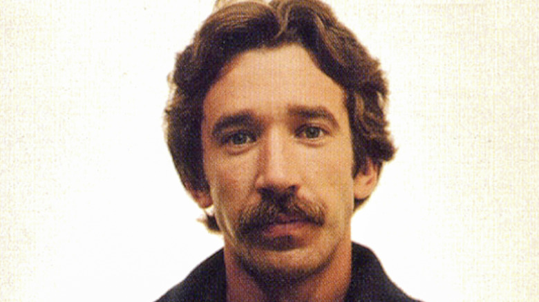 Tim Allen sad in mugshot