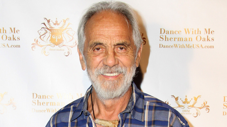 Tommy Chong smiling in plaid shirt