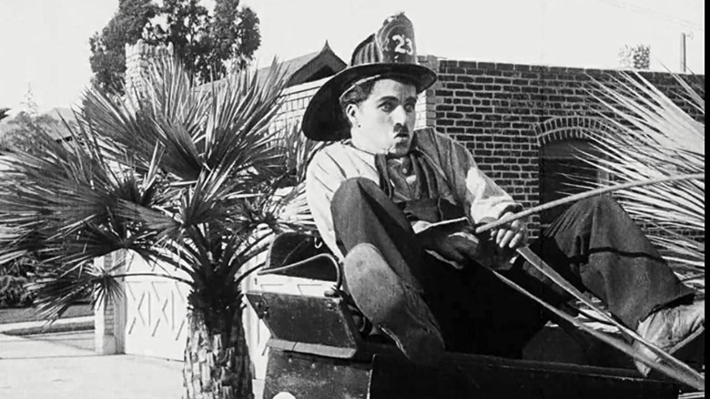 charlie chaplin wearing fireman costume