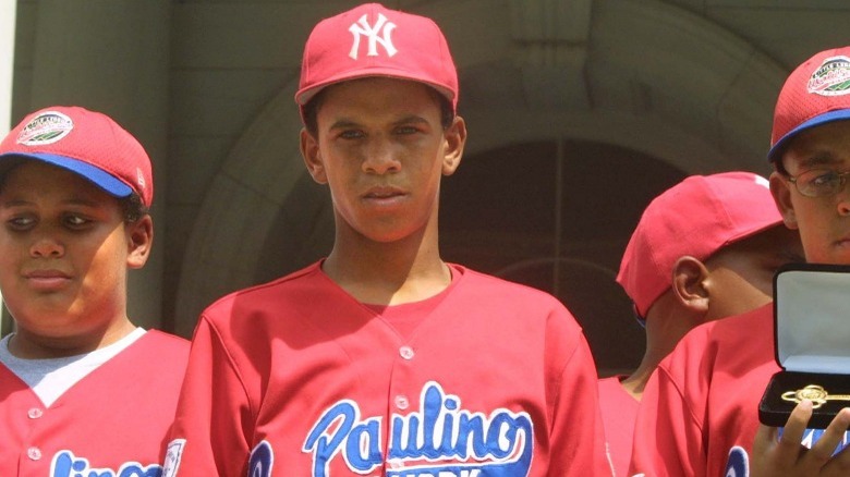 Danny Almonte holding trophy