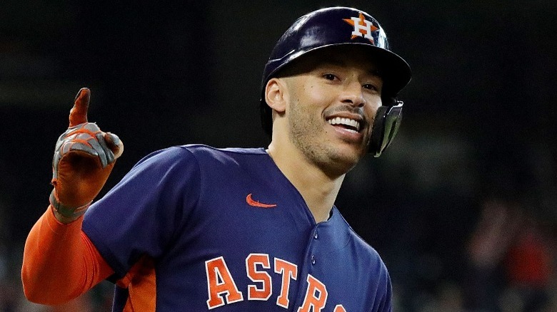 Carlos Correa pointing and running