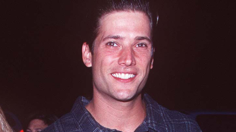 Sasha Mitchell smiling