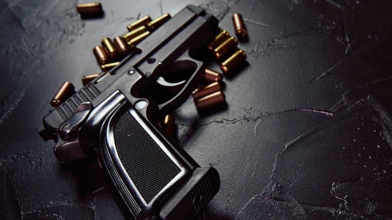 Light shining on gun and bullets