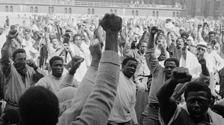 Inmates at Attica Prison with fists in air