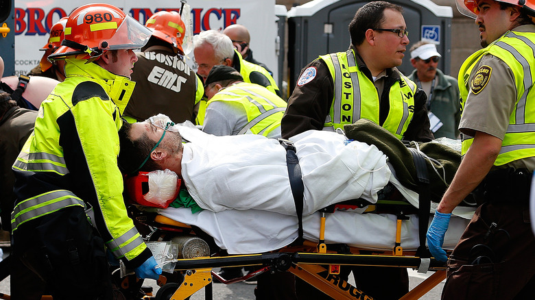 man loaded on stretcher