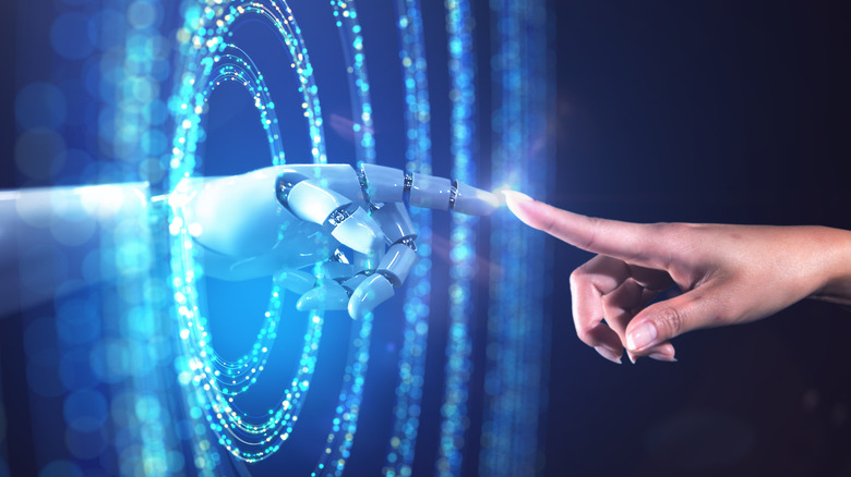 A robot and human touching hands