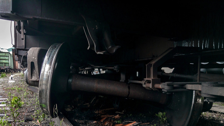 stock image of derailed train wheels
