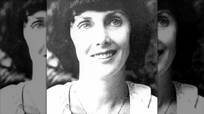 Marcia Moore smiling and looking to the side