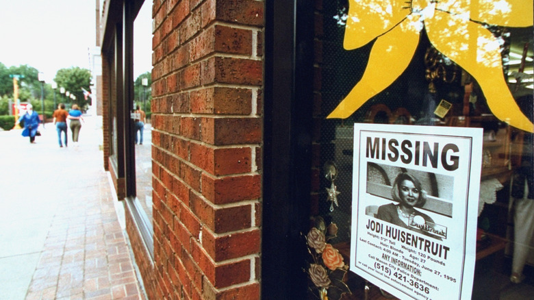 poster for missing jodinhuisentruit in window with yellow ribbon