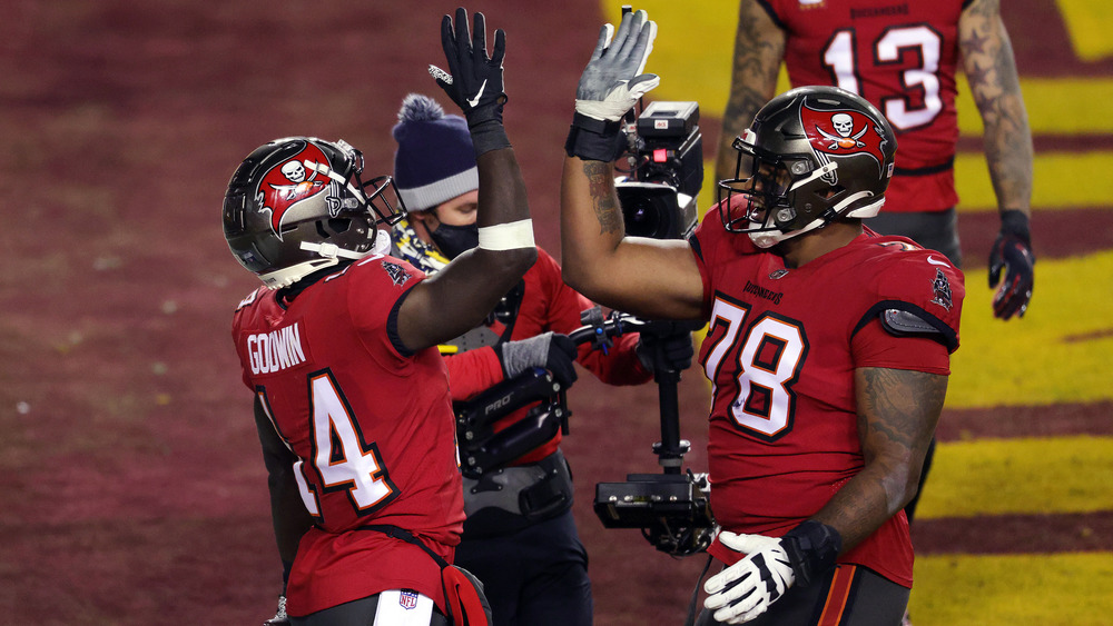 Bucs' Chris Godwin high-fives teammate