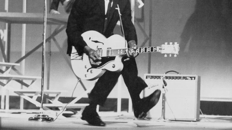 Chuck Berry posing for photo with guitar