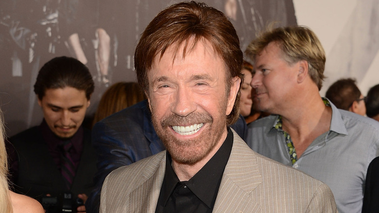 Chuck Norris smiling at The Expendables 2 premiere in 2012