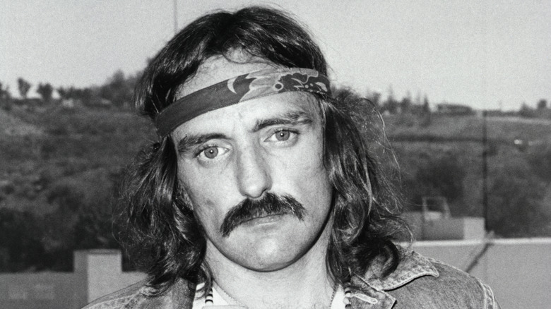 Dennis Hopper with long hair and a headband