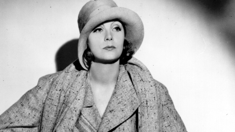 Greta Garbo in thick light jacket and hat