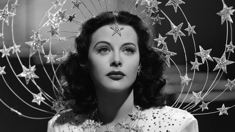 Hedy Lamarr wearing a star-encrusted headpiece