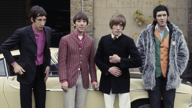 The Who in front of a car in the '60s