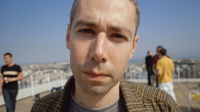 Adam Yauch outdoors glaring at camera