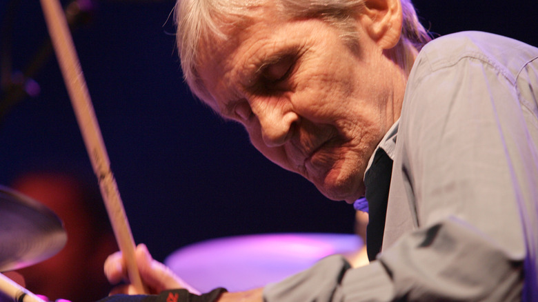 Levon Helm performing drums eyes closed