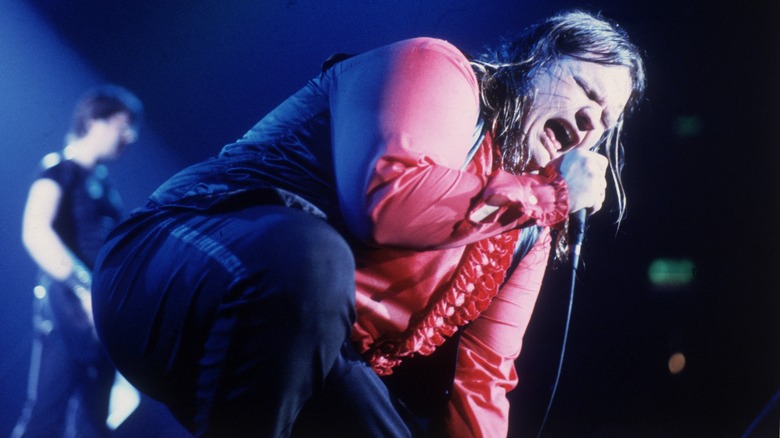 Meat Loaf red shirt kneeling singing