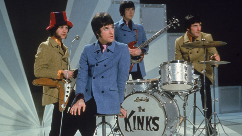 The Kinks performing heavy jackets looking right