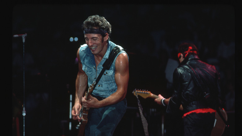 Bruce Springsteen smiles during 1984 performance