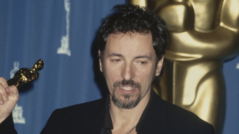 Bruce Springsteen holding his Oscar