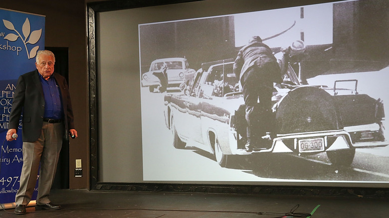Clint Hill speaking JFK assassination photo on projector