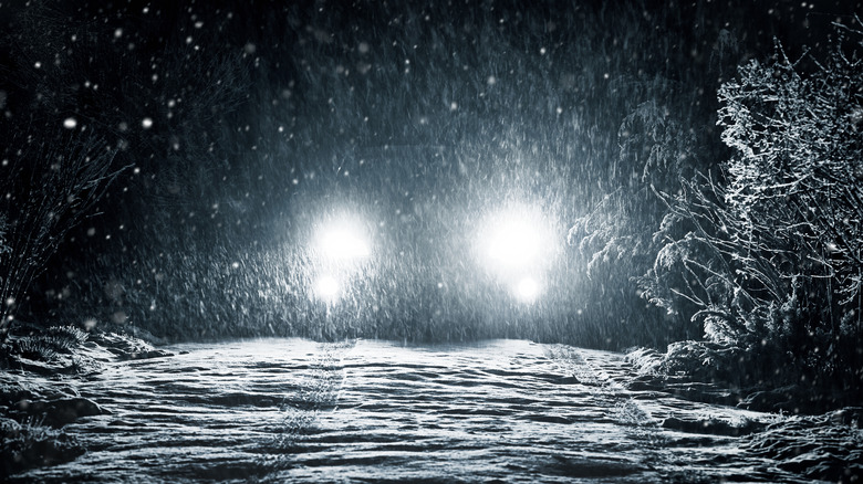 Headlights in a dark snowy night